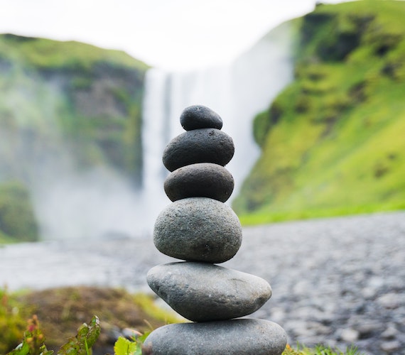 A balanced stack of grey stones.