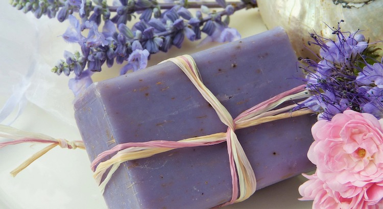 Lavender butter next to two sprigs of lavender.